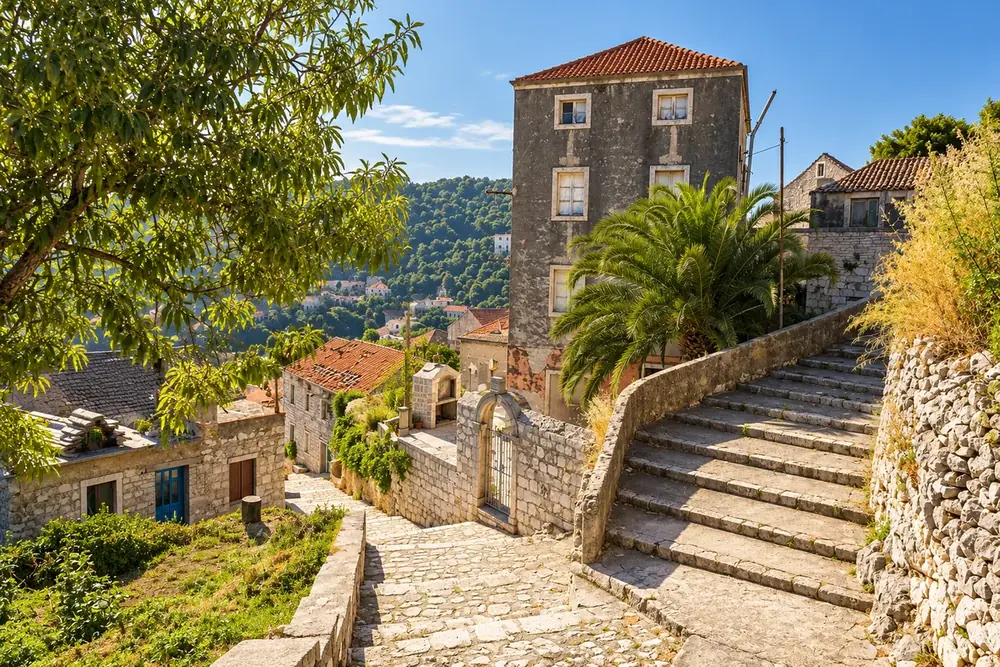 Sunlit stone lanes and steps in a Lastovo village